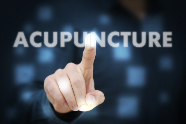 Businessman touching Acupuncture